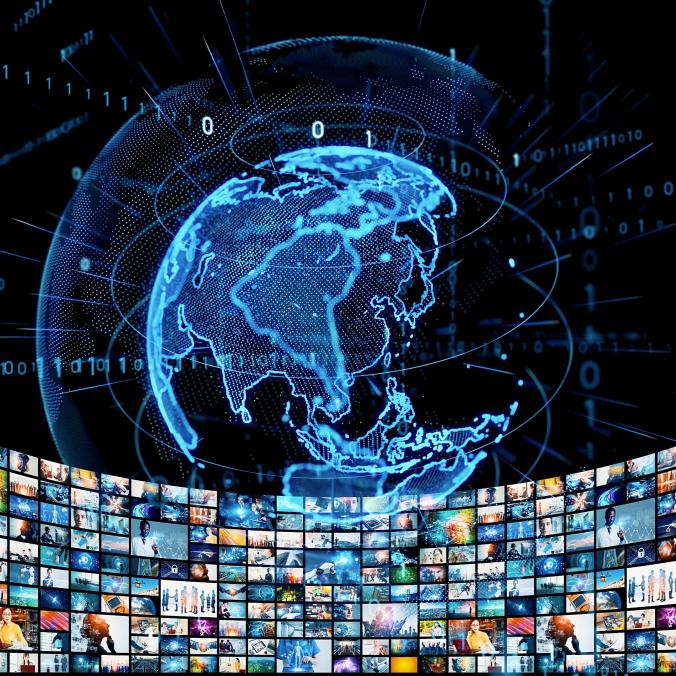 A digital globe with data lines and binary code, displayed above a wide array of multimedia screens